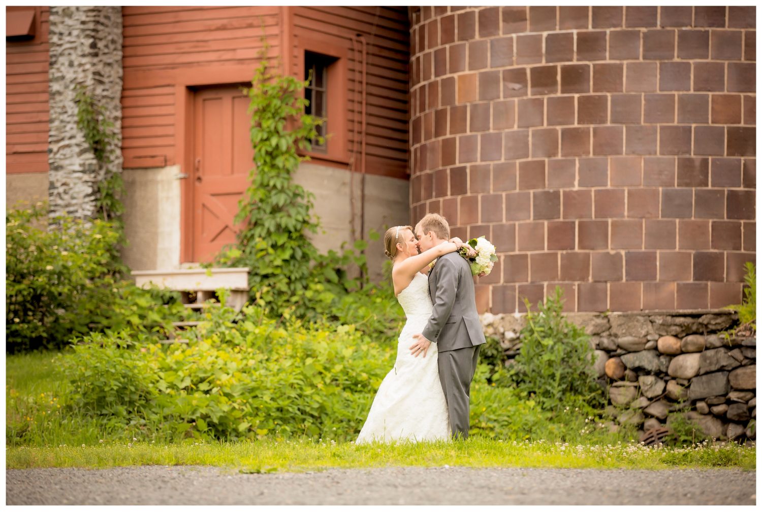 Rustic New England Wedding Photography at QuonQuont Farm- Couple in front of silo