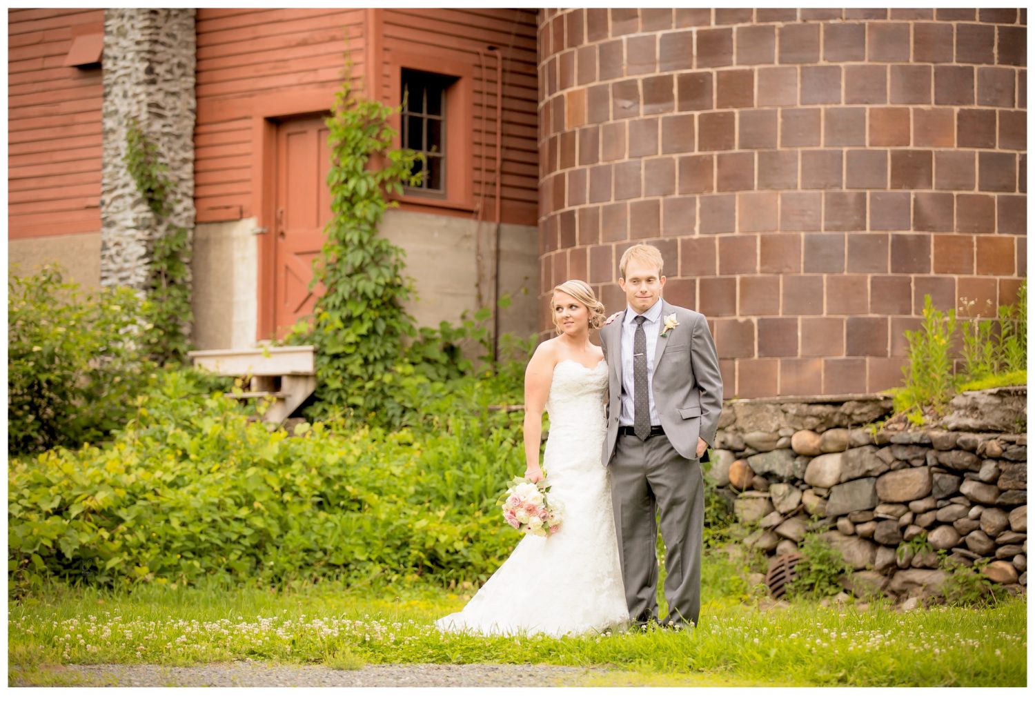 Bride and Groom in front of Silo at QuonQuont Farm in Whately MA. Rustic New England Wedding 