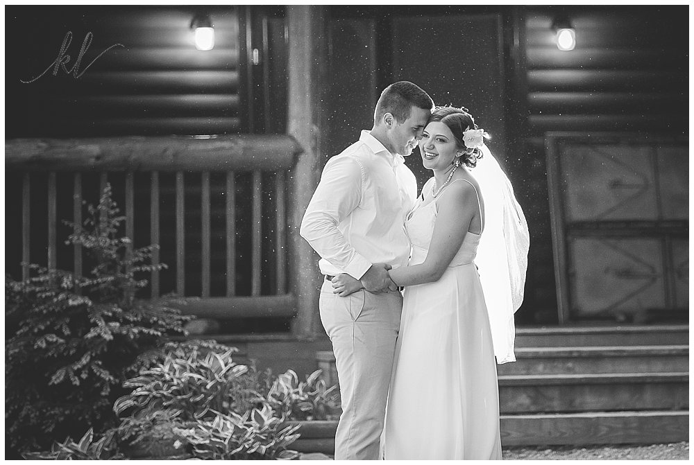 Black and White photo using Off Camera Flash of a bride and groom at Camp Takodah