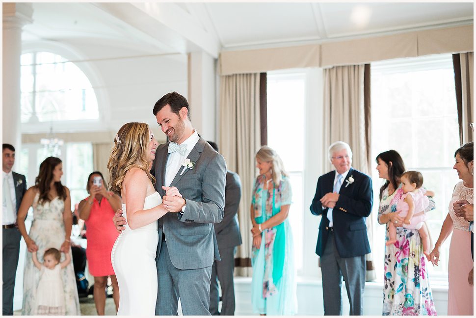 Bride and Groom's first dance together. They are smiling and laughing together. 