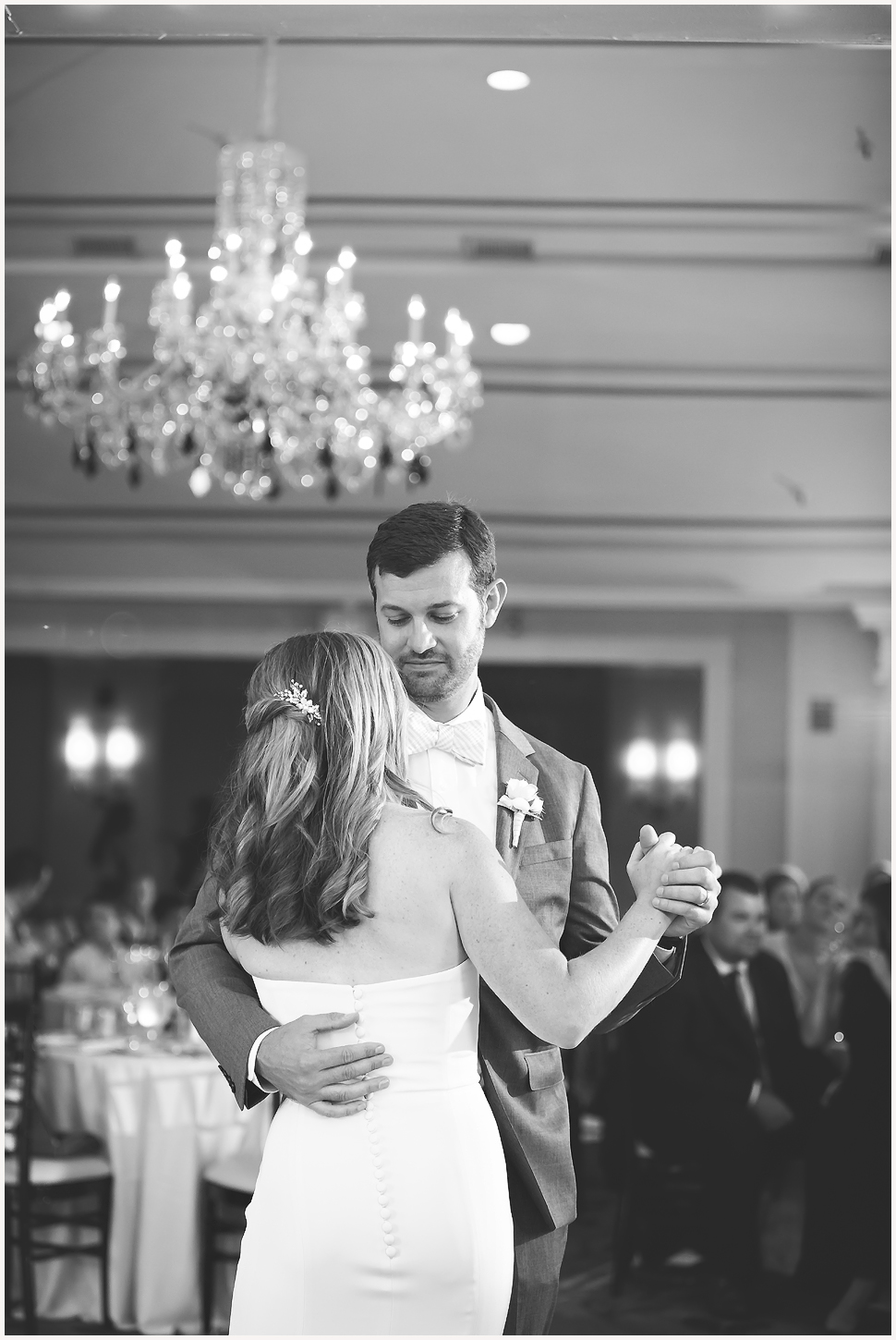 Candid black and white photo of a bride and groom dancing at the Equinox Luxury Resort. 
