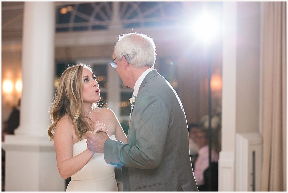 Bride is dancing and singing to her dad during their father daughter dance at the Equinox. 