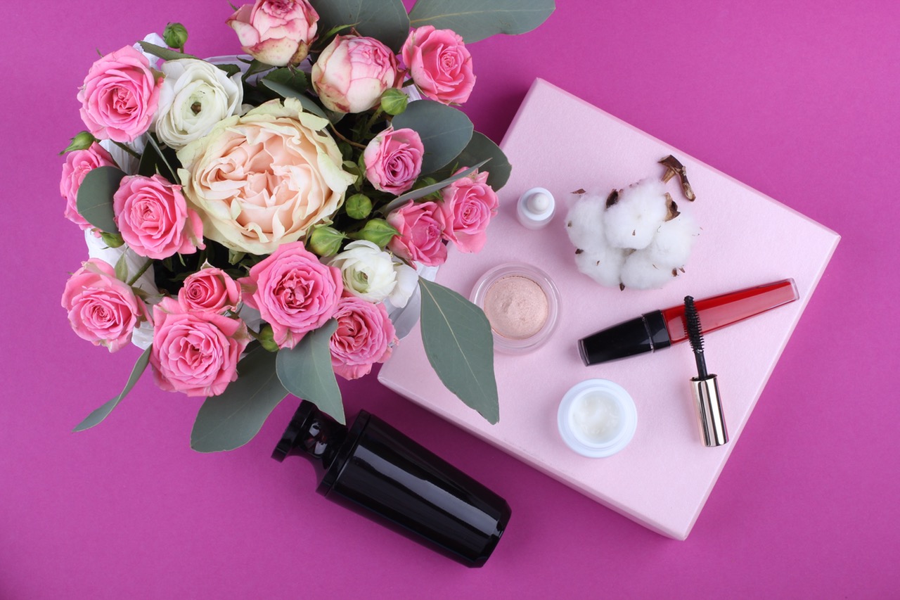 Best Beauty Tips and Trick For Your Wedding Day. Image shows pink flowers and make up pic from above. 