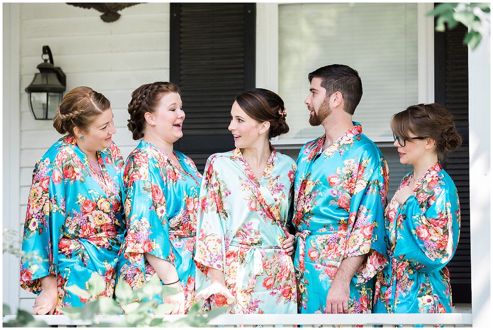 Photo showing bridesmaids wearing blue floral robes at Alyson's Orchard Wedding