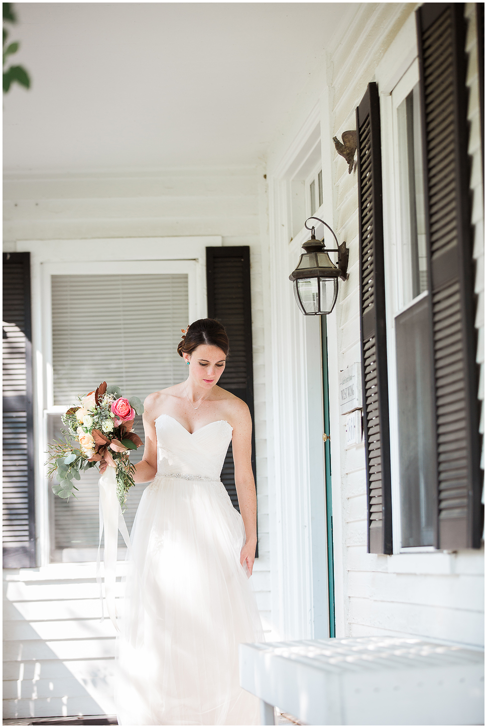Bride on the farm house porch at Alyson's Orchard in Walpole NH. 