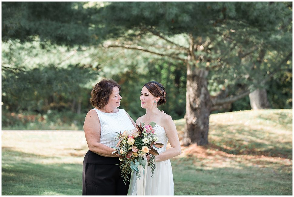 Candid portrait of a bride and her mother. 