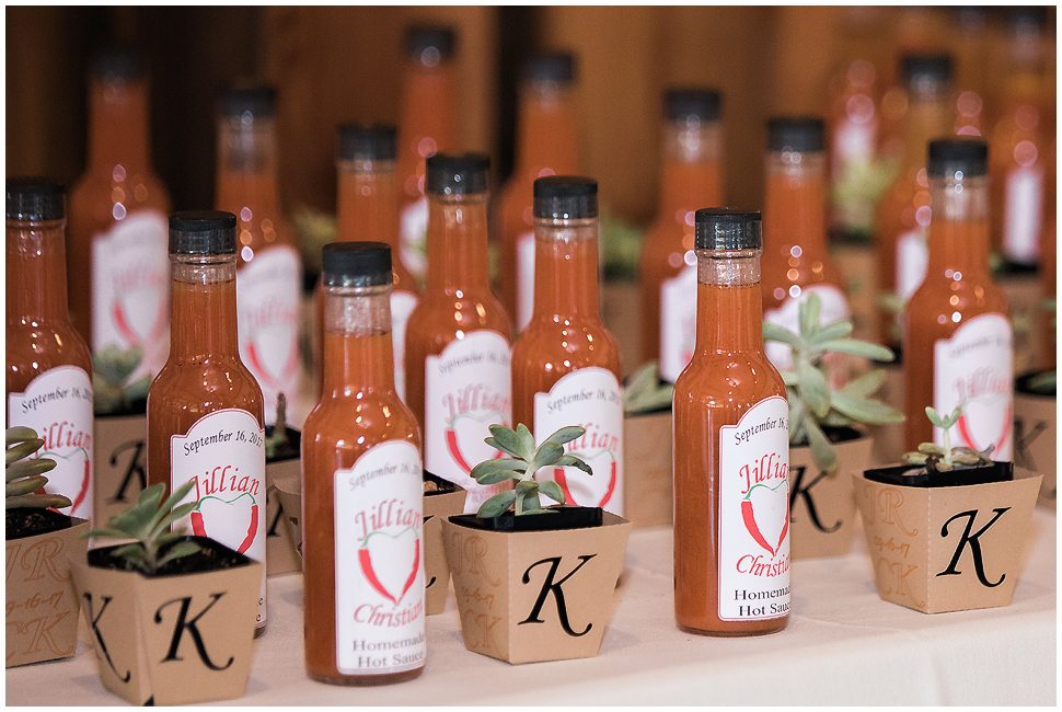 Custom made 'hot sauce" wedding favors with individual succulent plants in custom kraft planting containers. 