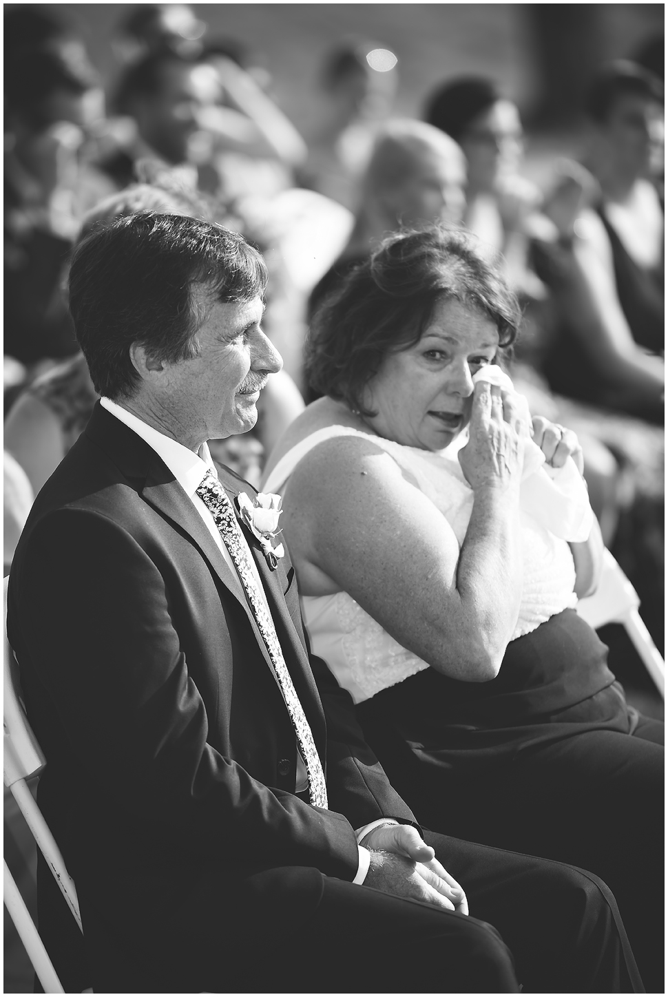 Black and White photo of parents crying during a wedding ceremony. 