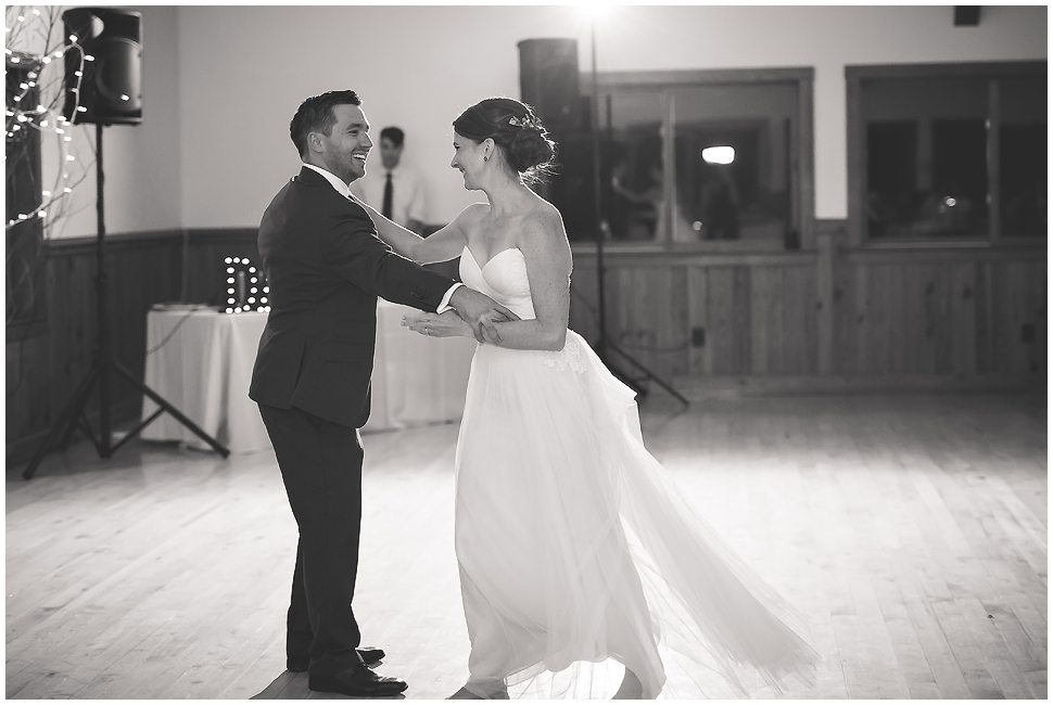 Black and white photo of bride and groom dancing at Alyson's Orchard. 