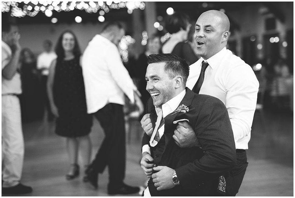 Men dancing at Wedding reception- black and white photo. 