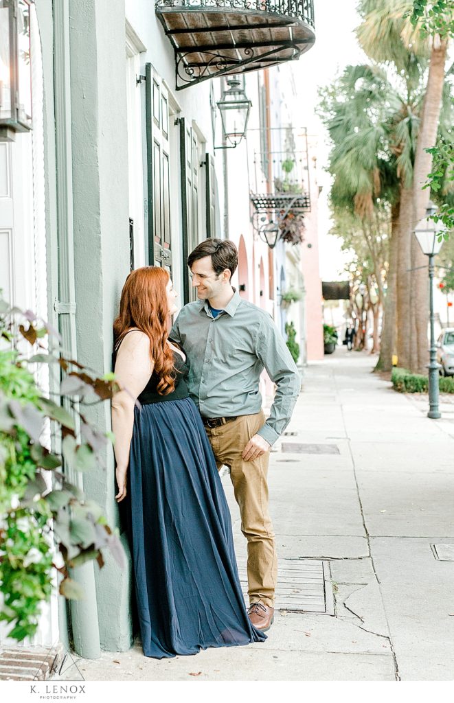Red headed woman wears a blue flowey dress for her Charleston SC Engagement Session with K. Lenox Photography