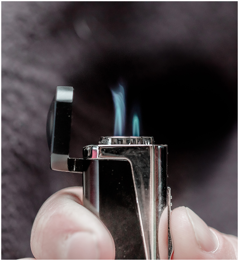 Lighter with flame. 