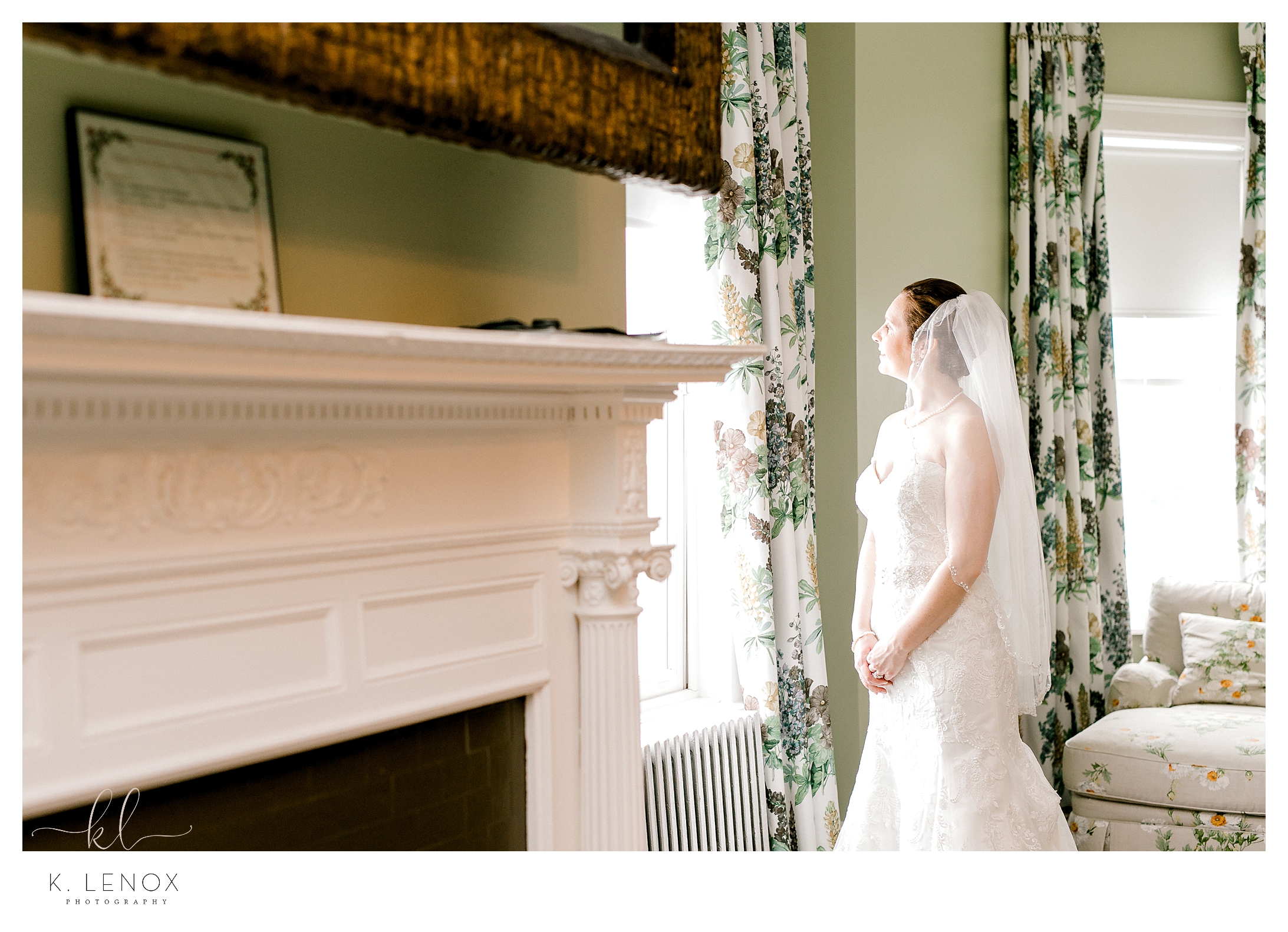 Bride looking out the window at the Omni Mount washington resorts, bridal suite.  