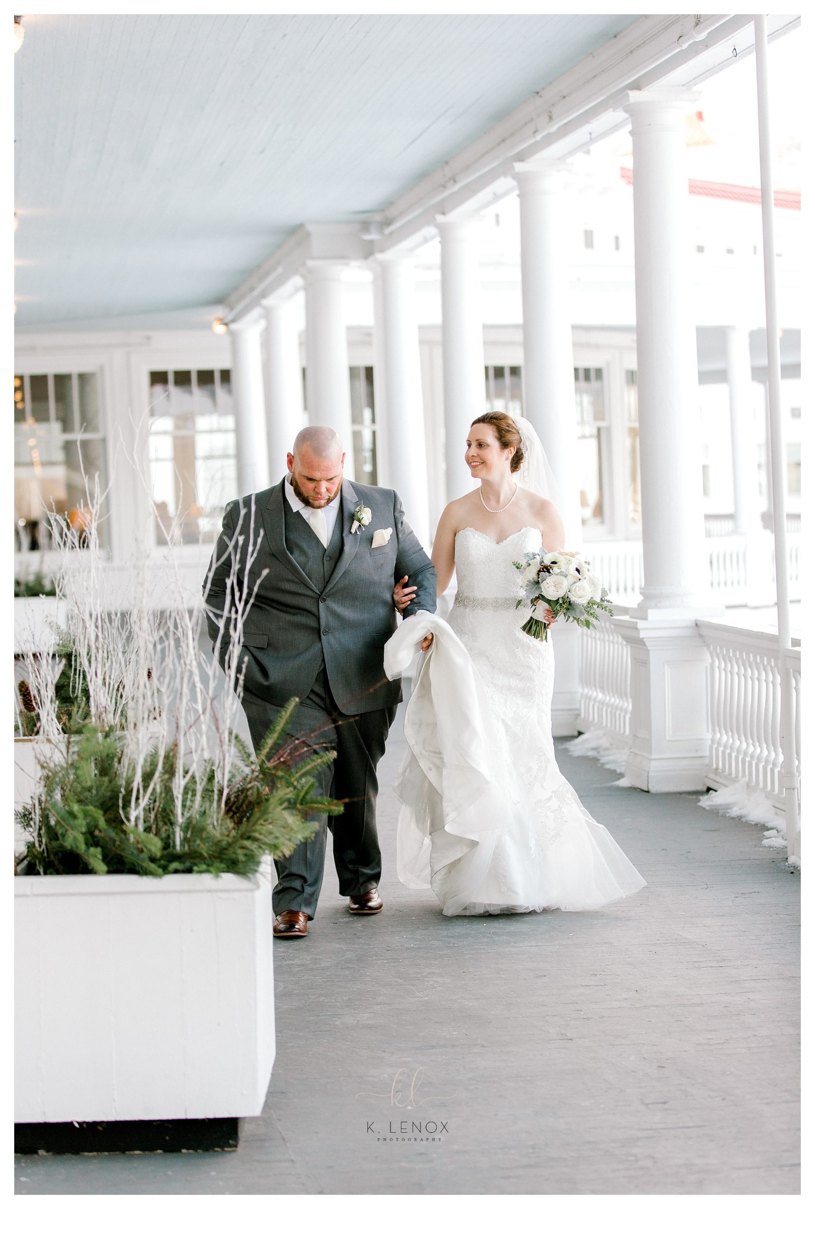Omni mount washington resort wedding showing bride and groom walking on the veranda