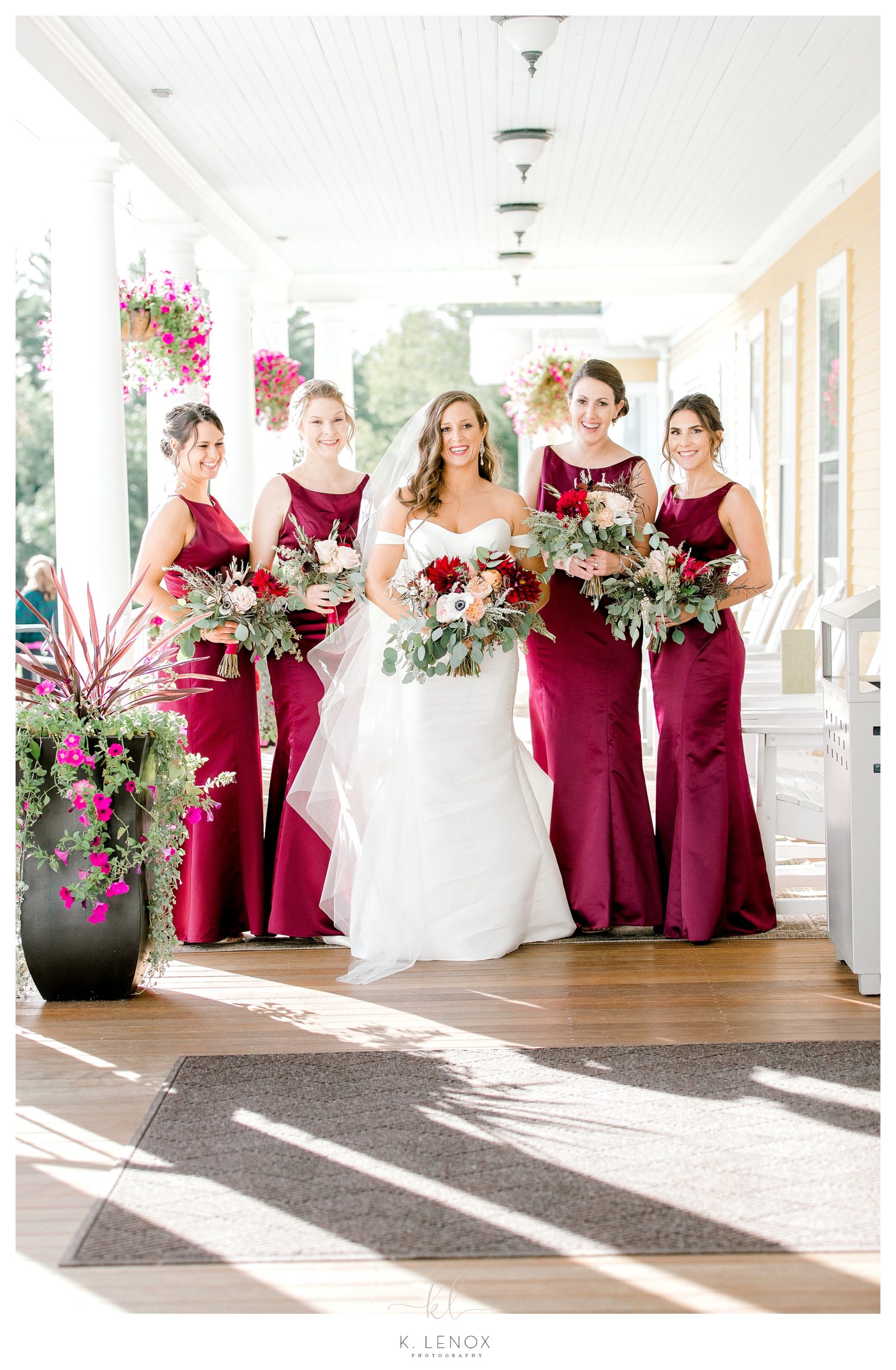 Bride with her bridesmaids wearing Red/Maroon gowns. 