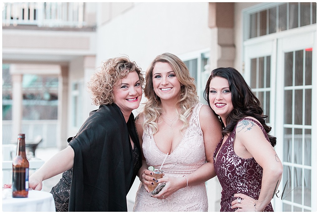 Wedding at Riverside Hotel NH. Three beautiful women at a wedding reception. 