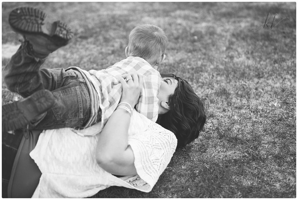 Fun Family Photos- Black and white photo of mom and son playing. 