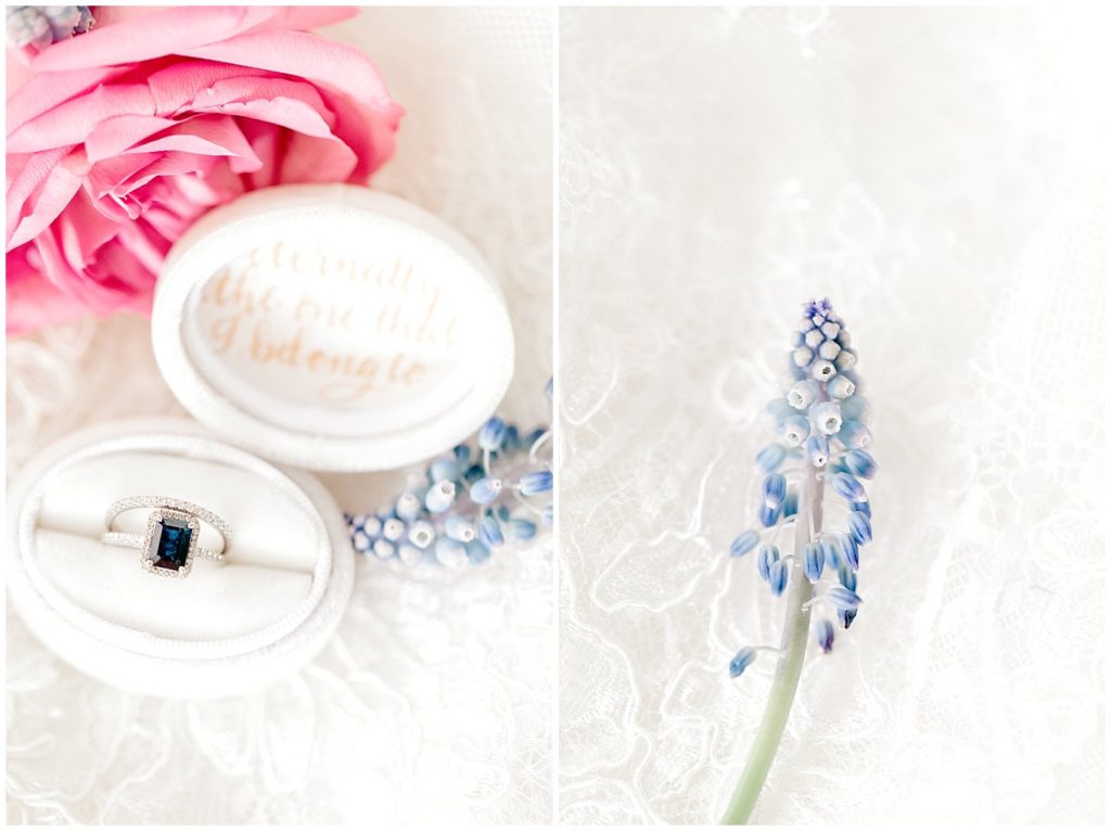 Bright and Airy Wedding photo of Blue Sapphire engagement ring, diamond wedding band and white velvet ring box. 