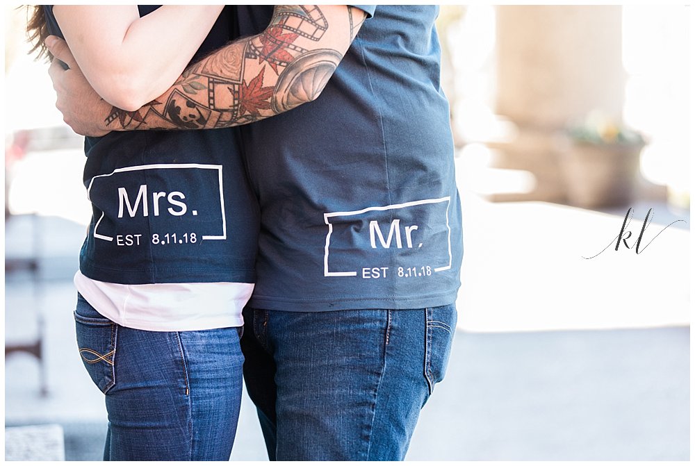 Couple wearing blue t-shirts custom made with wedding date. 