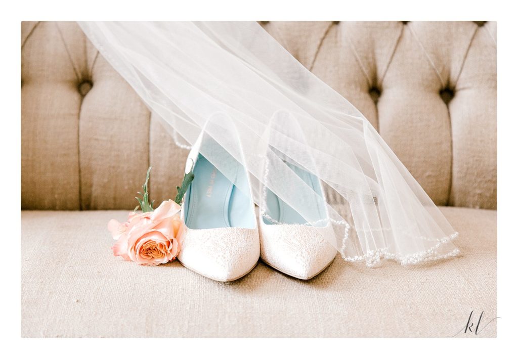 Light Peach wedding shoes with peach rose and veil.  Detail photo taken at the Bedford village inn summer wedding.  