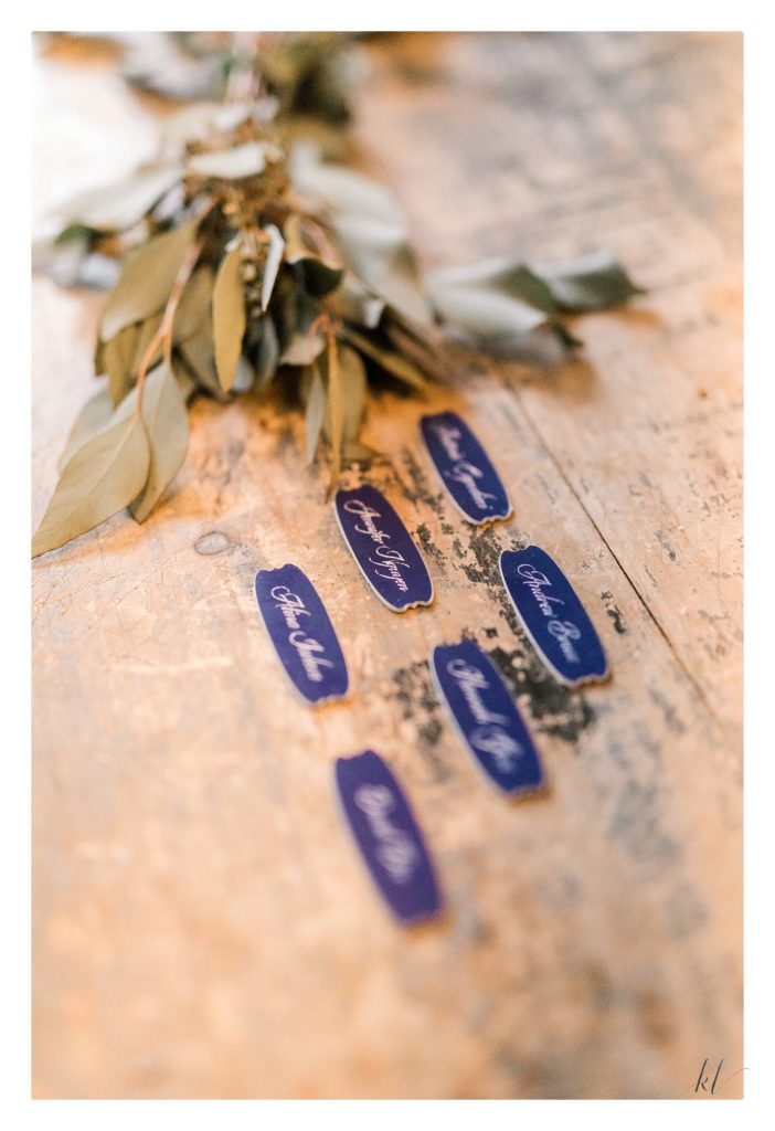 personalized engraved seating chart tags for  a summer wedding at the Bedford Village inn. 