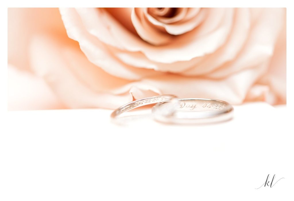 Peach Rose and platinum wedding bands with inscriptions. Light and airy photos by K. Lenox Photography. 