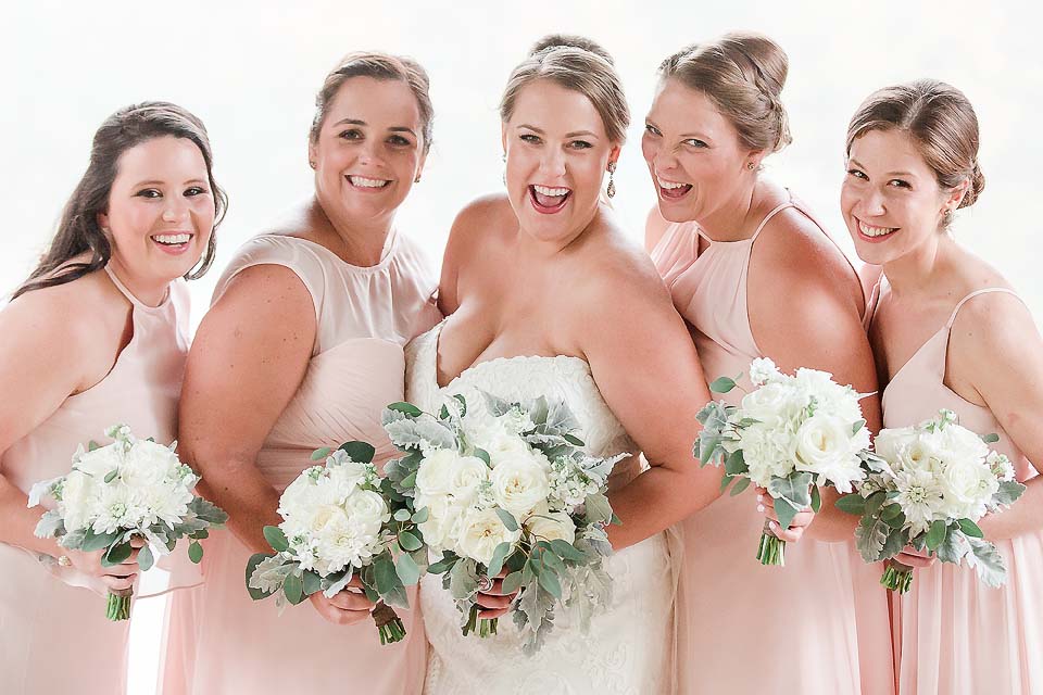 Photo of Bride with girls wearing Millennial Pink Bridesmaids dresses at Stratton Mountain. 