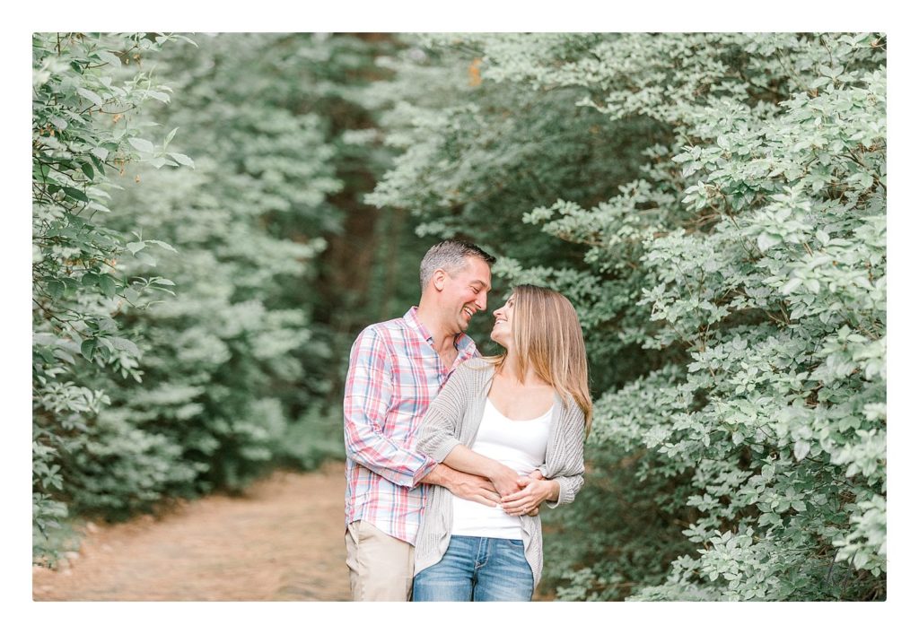 Rustic Engagement Photo of a man and woman in the woods. 
