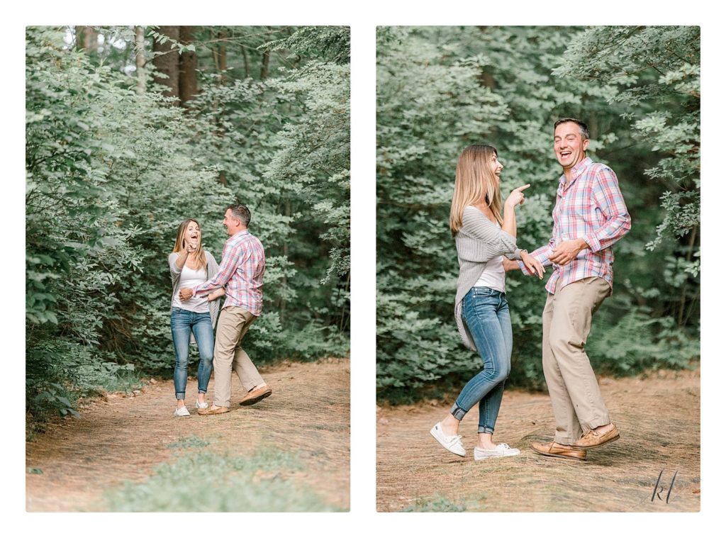 Fun and informal rustic engagement photo taken of a couple on a path in the woods