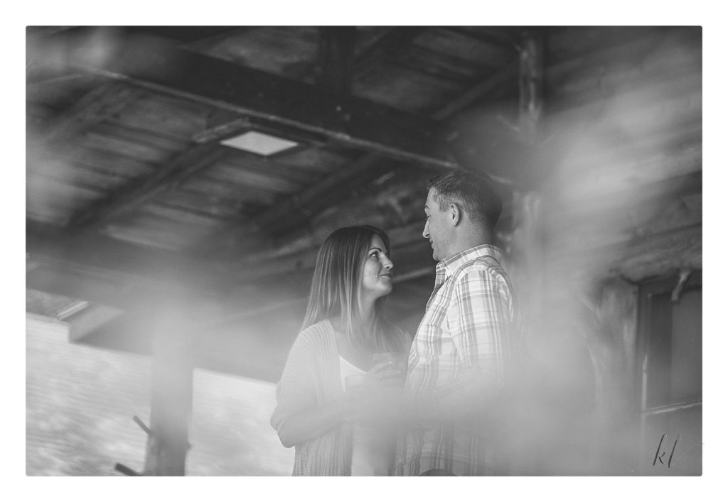 Black and White Candid photo of a couple during their Rustic Engagement Photos session. 
