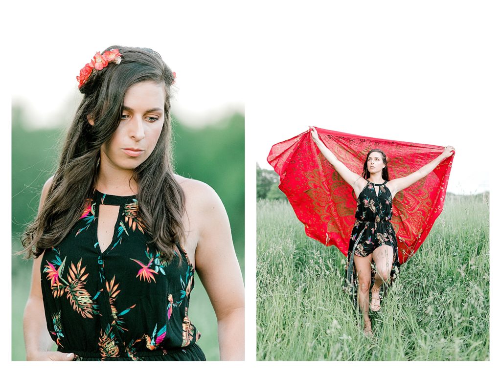 Bohemian Inspired Photoshoot showing a girl wearing a black flowered dress and playing with a bright red wrap. 