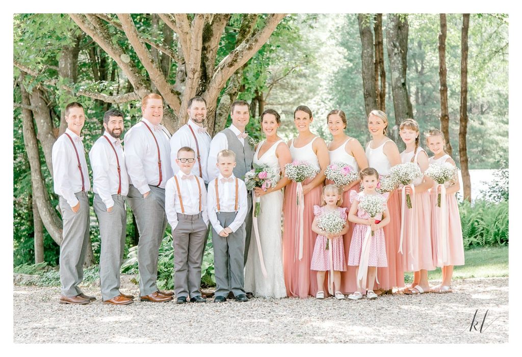 Full Wedding Party formal portrait showing colors grey, white and pink. 