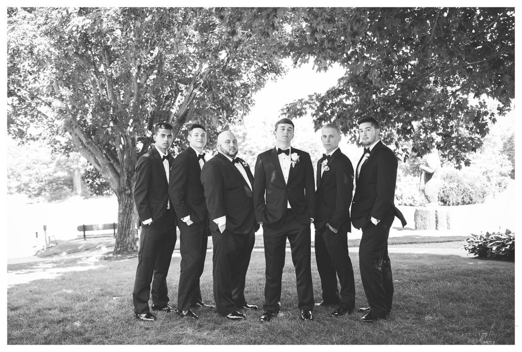 Groom and his groomsmen pose for a formal portrait at the Keene Country Club Summer Wedding. 