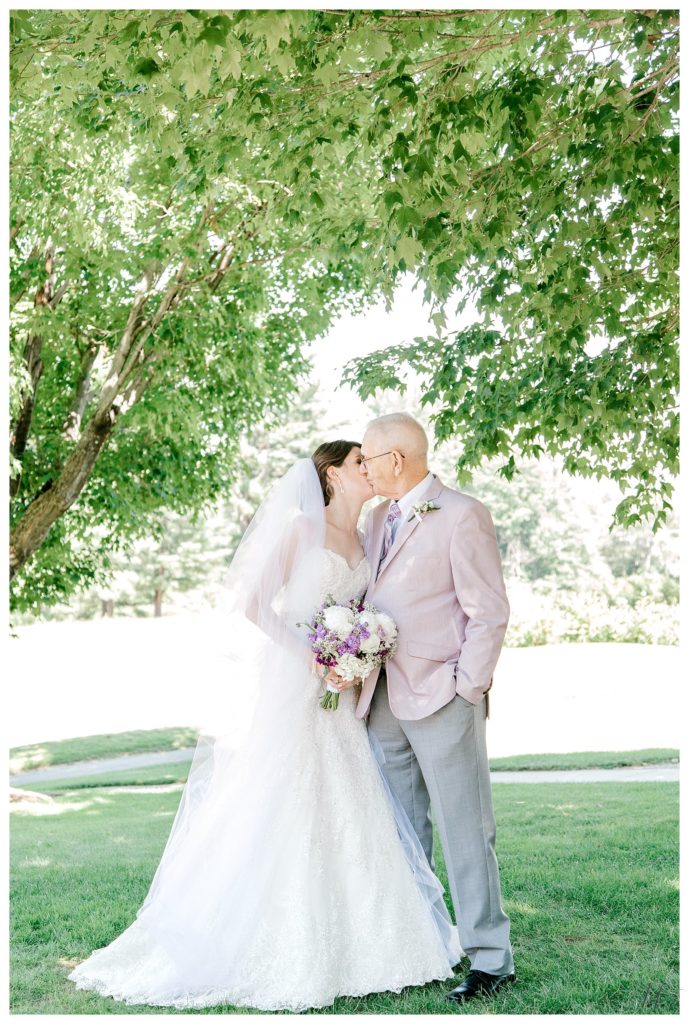 Bride Kisses her grandfather for a formal portrait at her Summer Keene Country Club Wedding. 