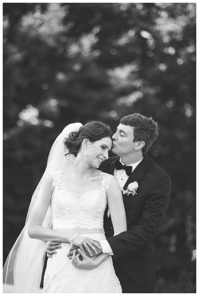 Candid and natural Black and White Photo of a bride and groom at the Keene Country Club for their Summer Wedding Reception. 