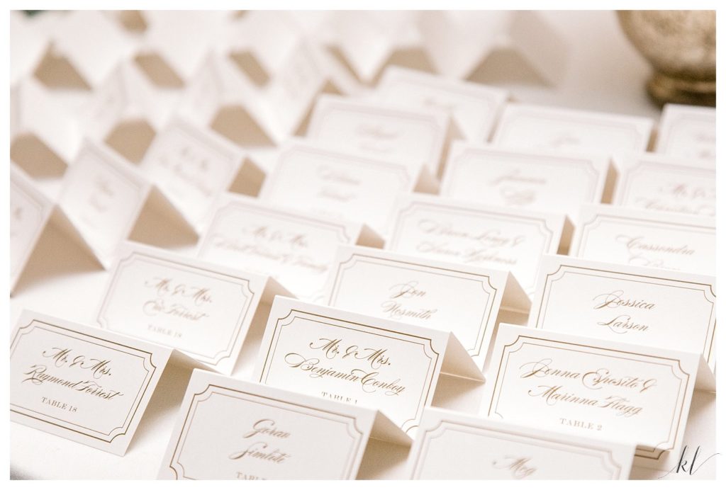 Simple White Wedding place cards with Gold writing. 