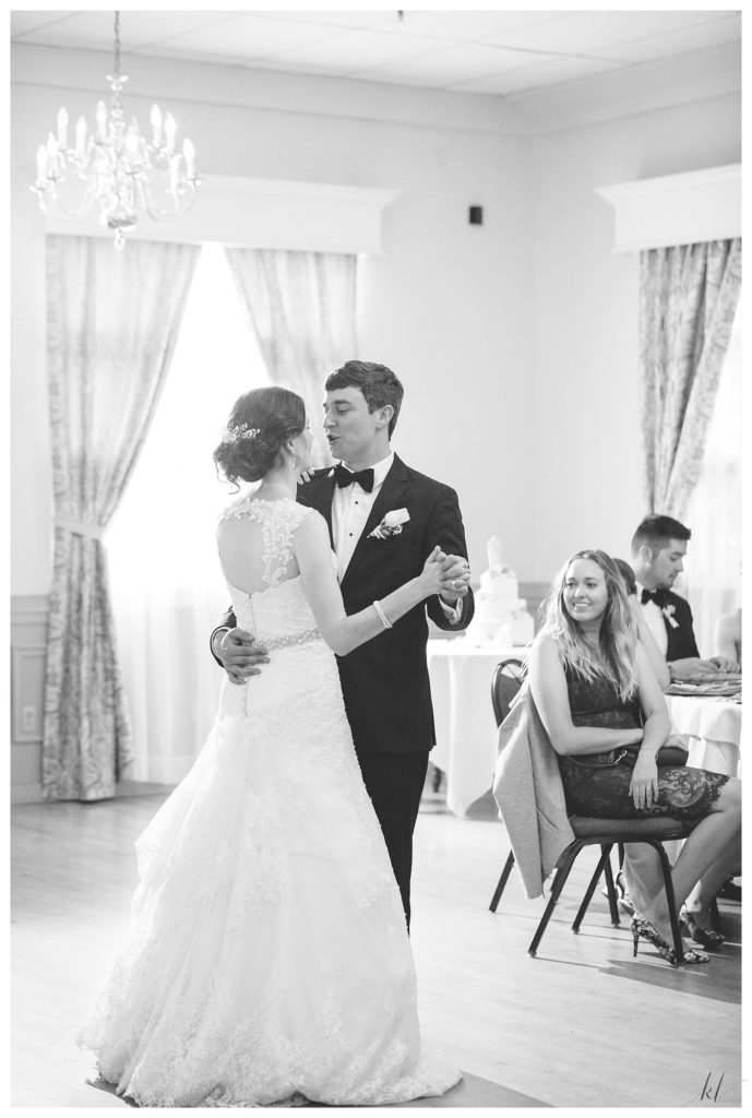 Black and white photo of a bride and grooms first dance at the Keene country club for a summer wedding. 