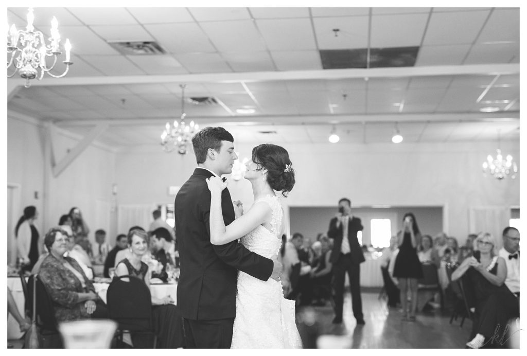 Black and white photo of a bride and groom having their first dance during their summer wedding at the Keene Country Club. 