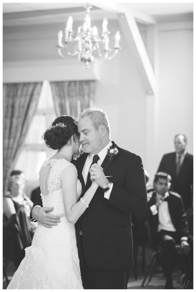 Black and White photo of a father dancing with his daughter at her summer wedding at the Keene Country Club