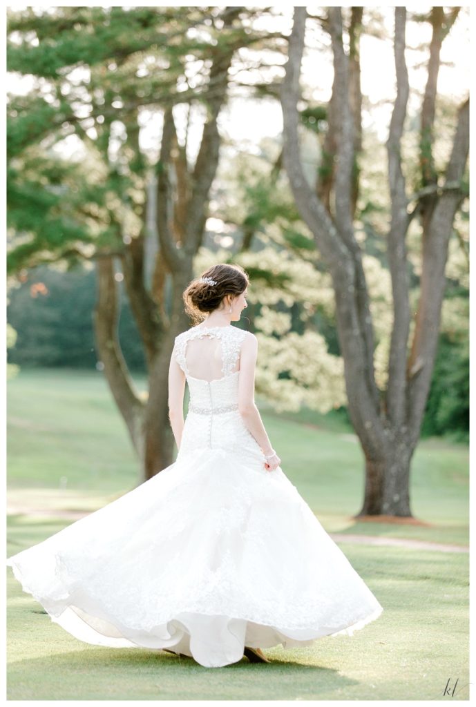Candid photo of a bride taken during the golden hour at the Keene Country club 