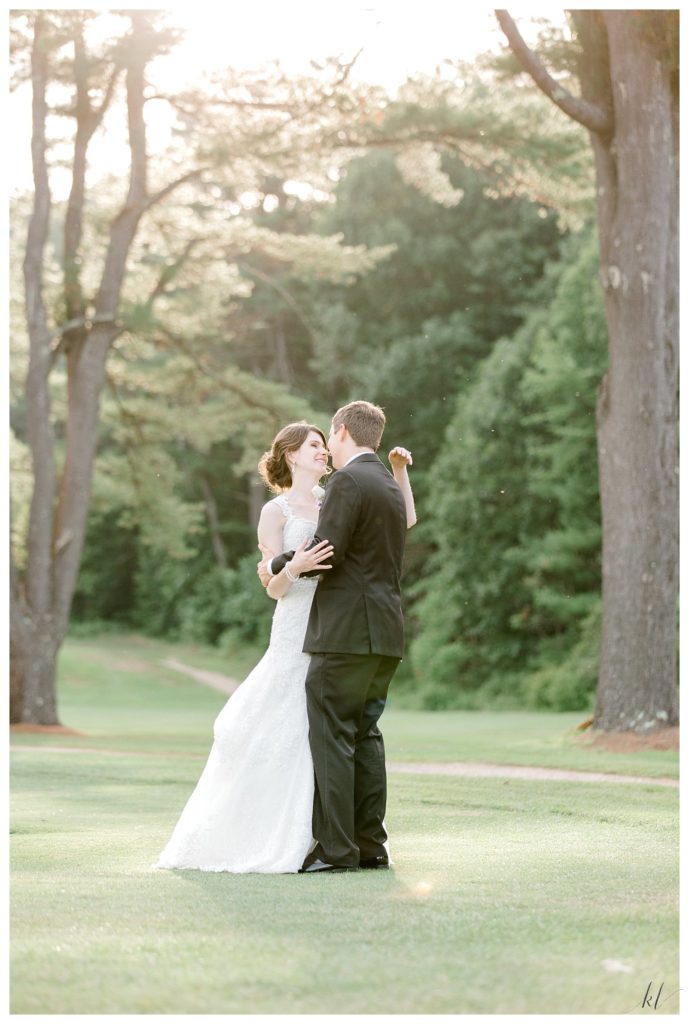 Candid and natural photo of a bride and groom taken during golden hour at the Keene Country club. 