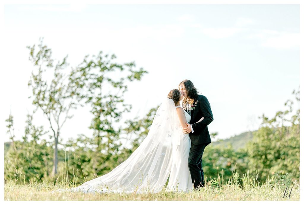 Candid and natural photo of a bride and groom at Mayfair farm in NH. 