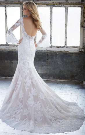Lacy white Belle Sleeve Boho Wedding Dress. 