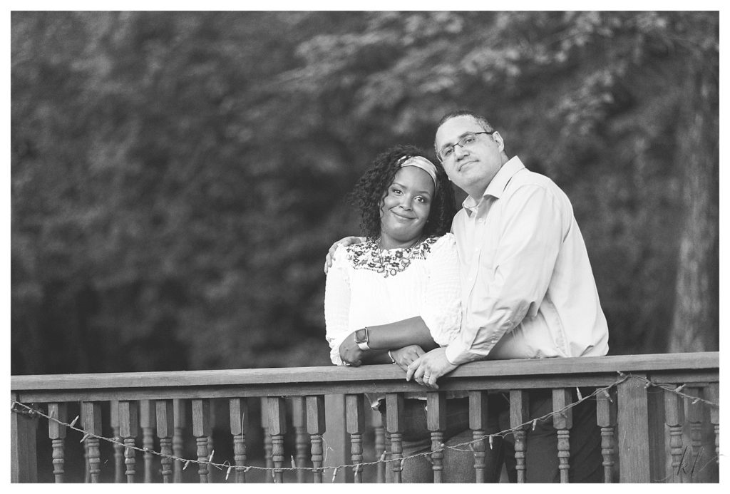 Black and White photo of a man and woman on the bridge at the Alpine Grove Banquet Facility during their Engagement Session
