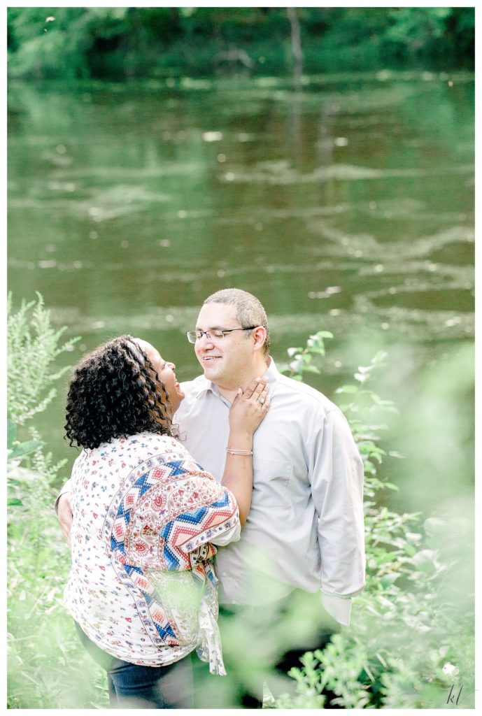 Interracial couple joyfully interact and laugh during their Alpine Grove Engagement Session | Hollis NH - 