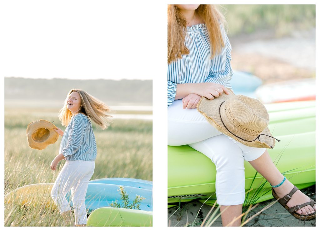 Playful and Candid photo of a high school senior on Drakes Island playfully spinning with a hat in her hand. 