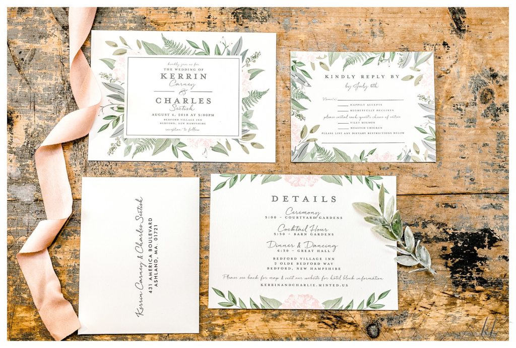 White Wedding Invitation suite from Minted, shown on a rustic wood table. 