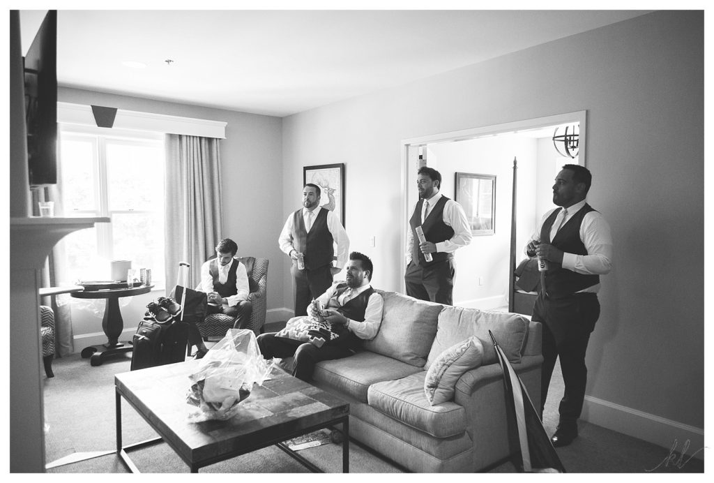 Groomsmen and Groom watch a game on TV at the Grand- Bedford NH srcset=