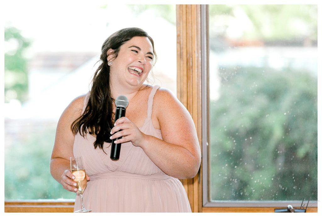 Bridesmaid wearing a dusty pink gown gives her toast at the Bedford Village Inn. 