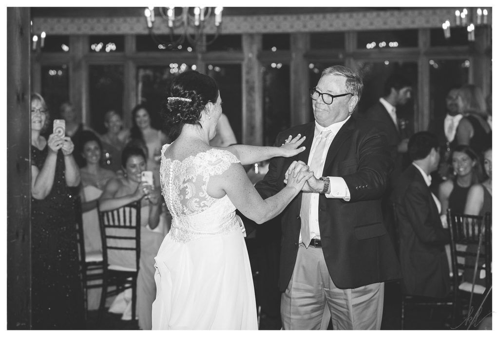 Black and White photo of a Bride dancing with her father at the BVI in Bedford New Hampshire. 